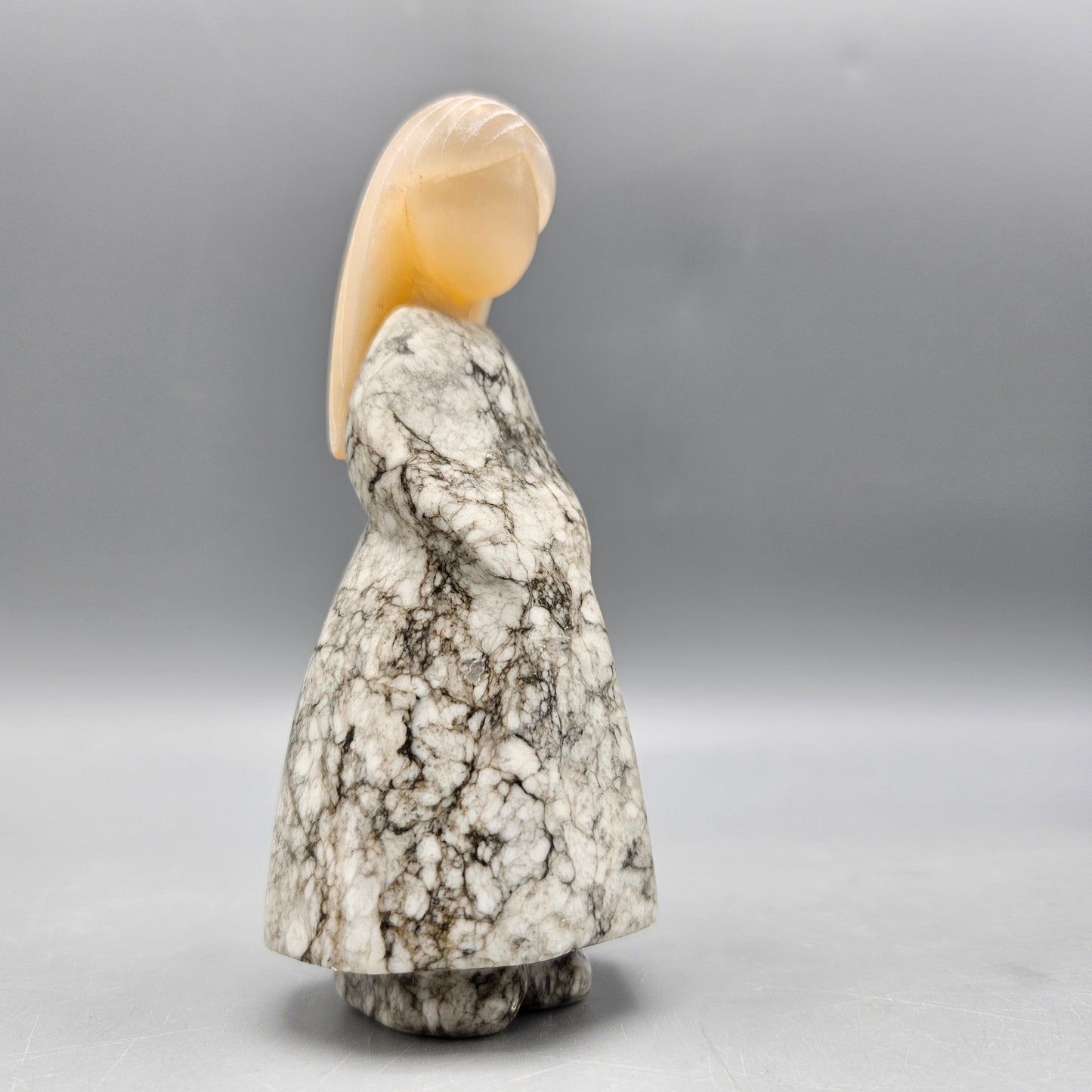 Carved Stone Figure of Woman in Dress