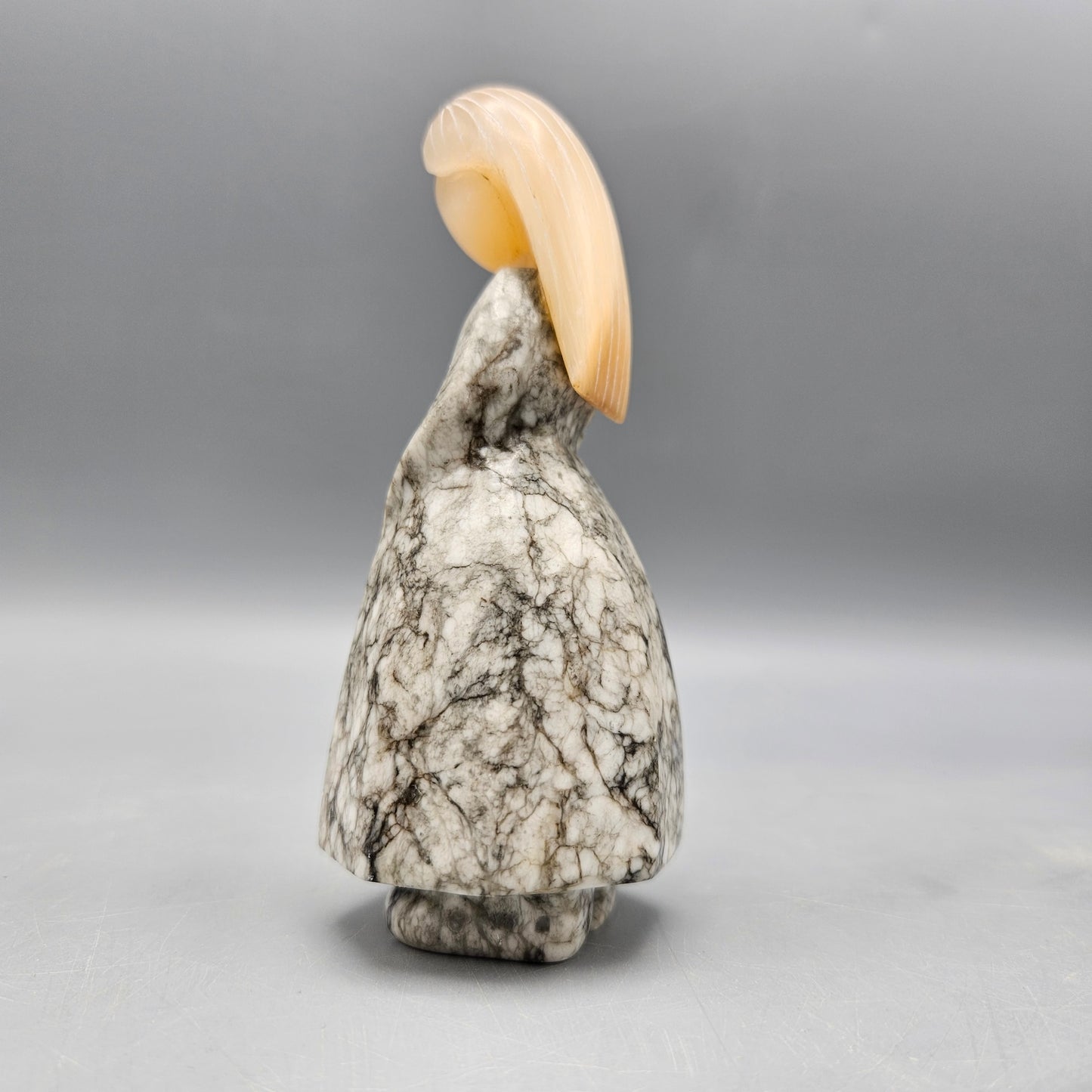 Carved Stone Figure of Woman in Dress