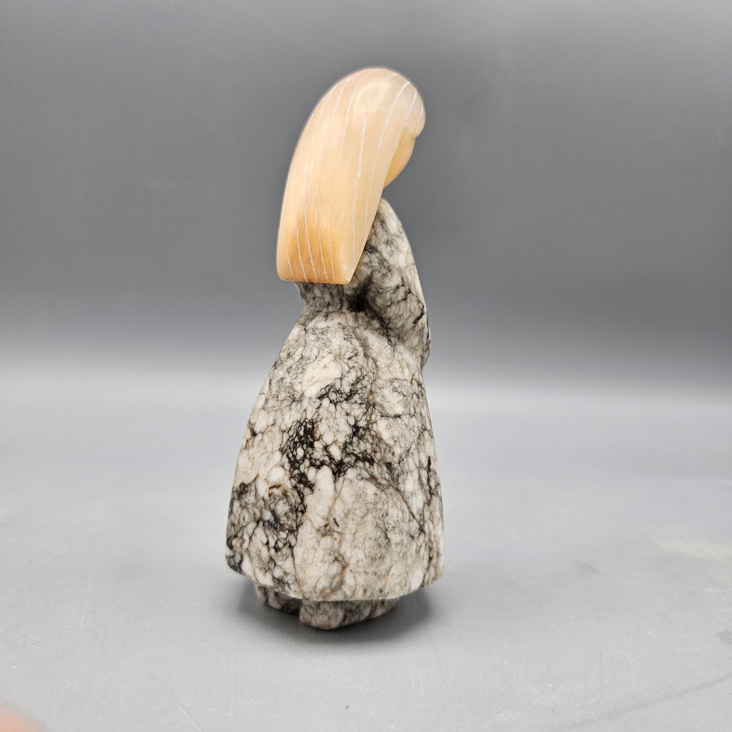 Carved Stone Figure of Woman in Dress