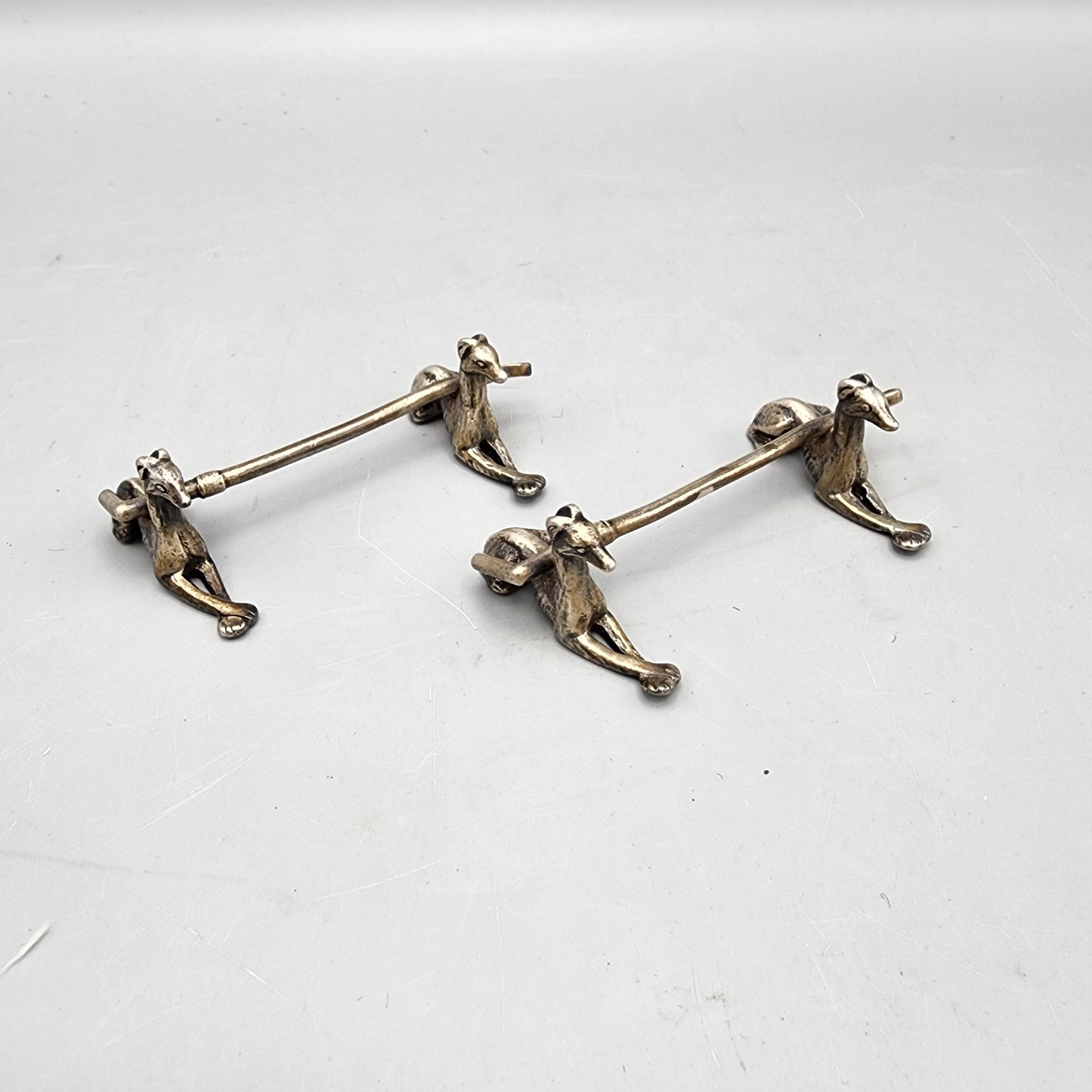 Two Silverplated Knife Rests with Greyhounds
