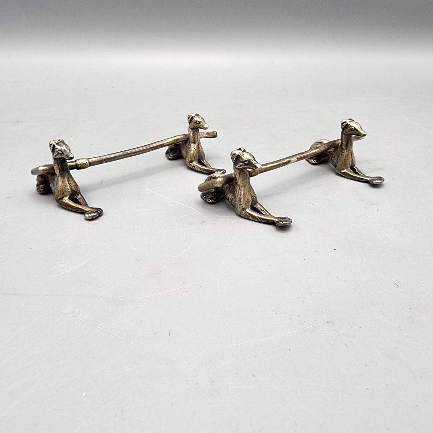 Two Silverplated Knife Rests with Greyhounds