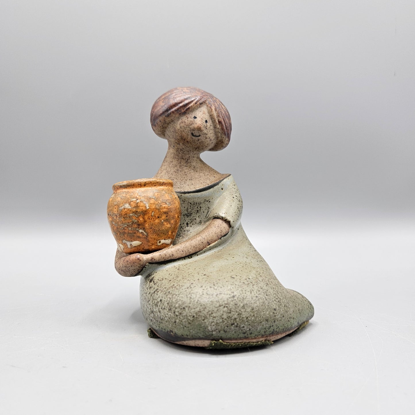 Japanese Stoneware Girl with Flower Pot Figurine