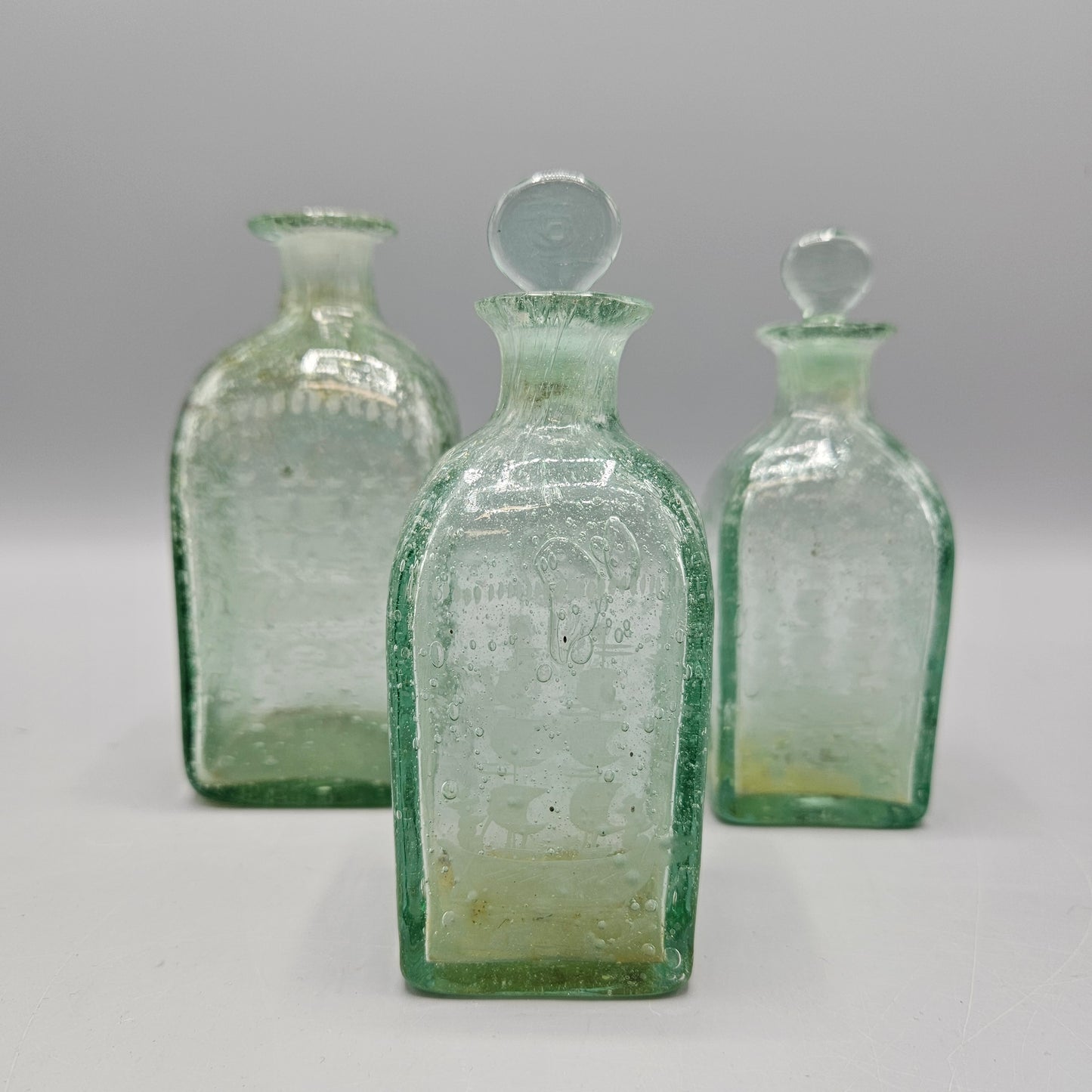 Three Vintage 1920s Bohemian Seeded Glass Bottles