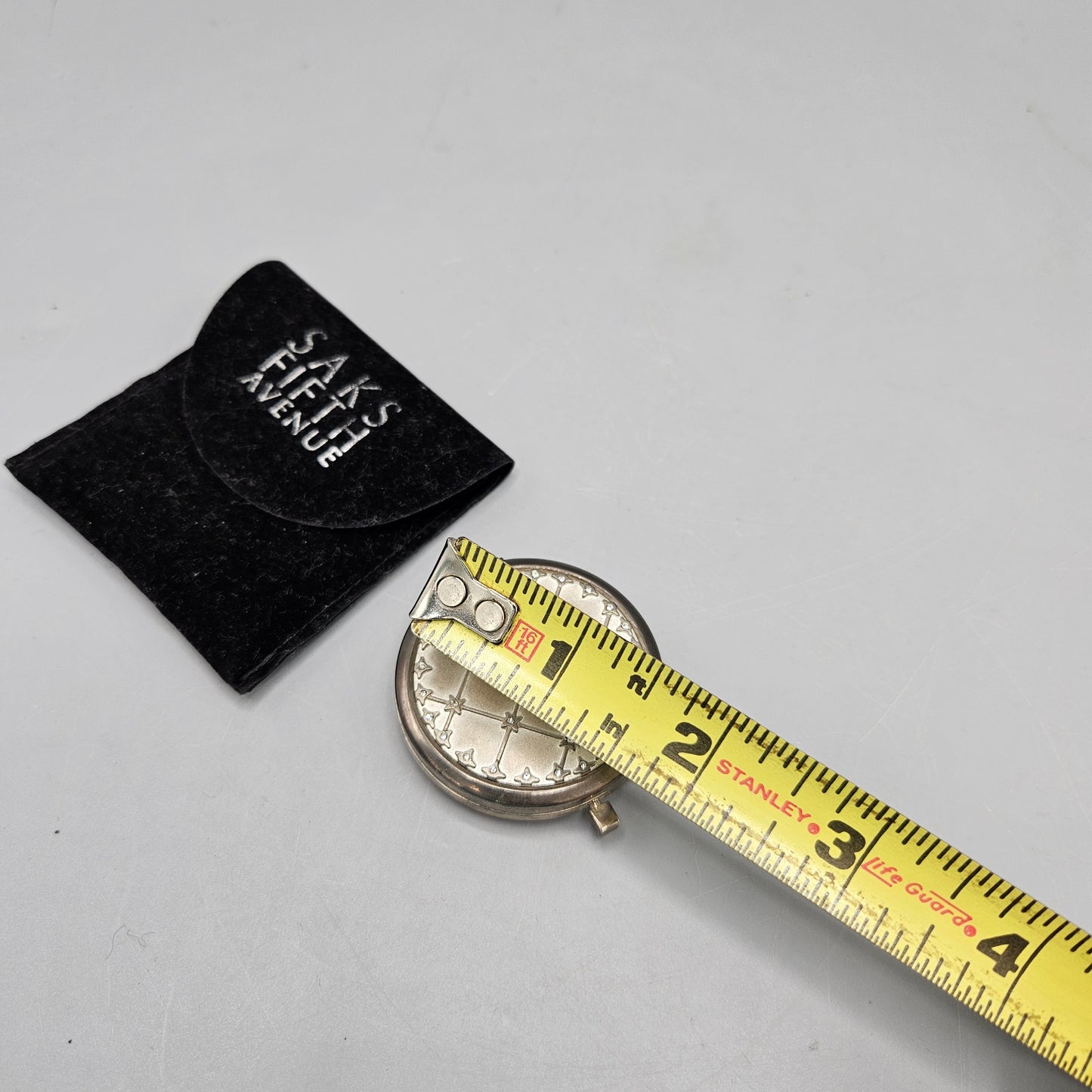 Saks Fifth Avenue Silver Metal Quilted Compact Mirror