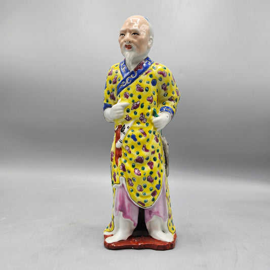 Vintage Porcelain Figure of Man in Yellow Jacket