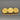 Gold-tone brooch with three classical coin motifs on gray background