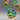 Detail of lower half showing mixed blue, green stones and gold textured finish