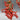 Detailed shot of the vibrant red coral branches and metal chains