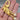 Back clasp and texture of gold tone brooch in hand